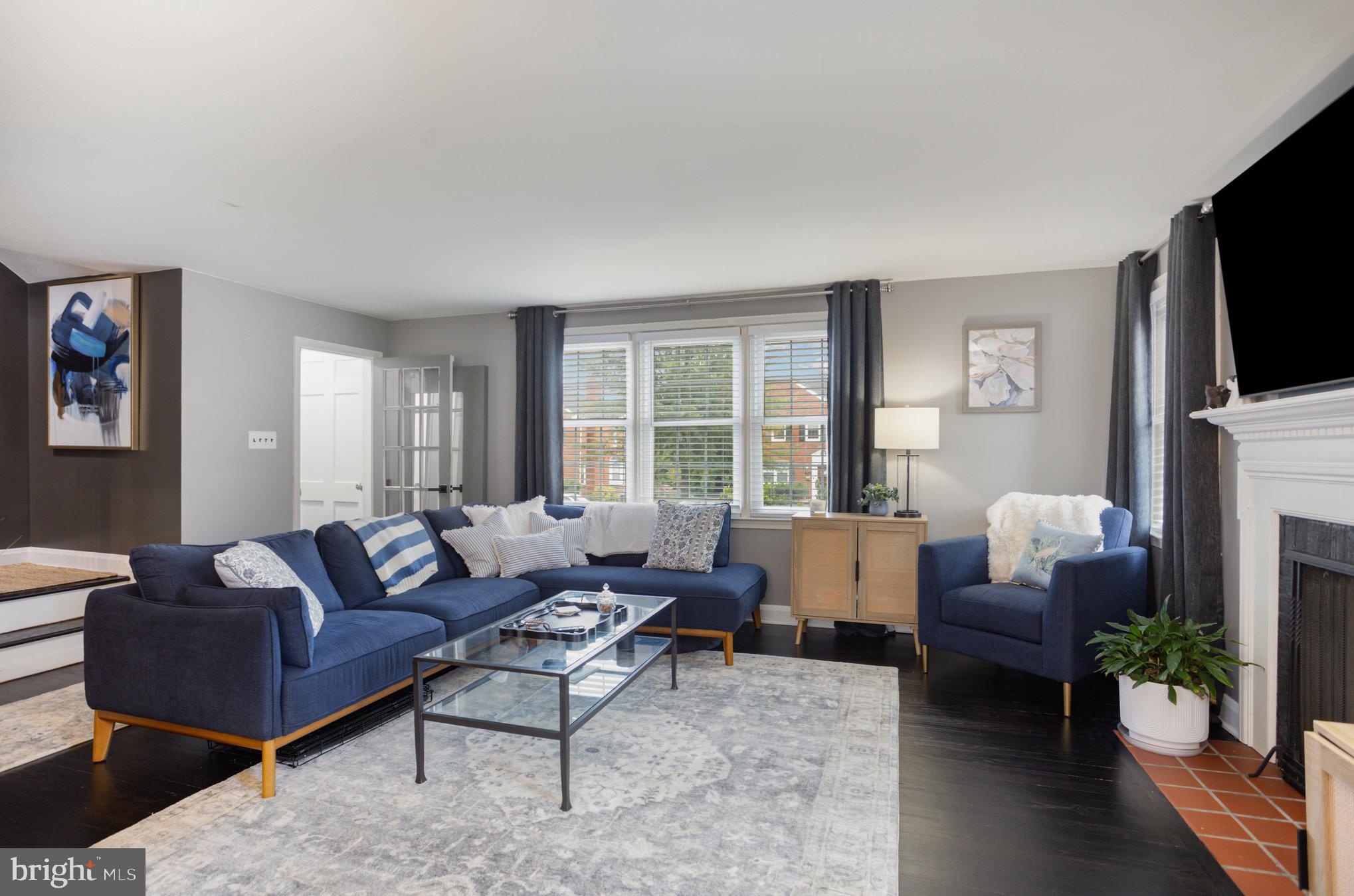 1500 Doxbury Road Baltimore, MD 21286 - Photo 5 of 36 a living room with fireplace furniture and a flat screen tv