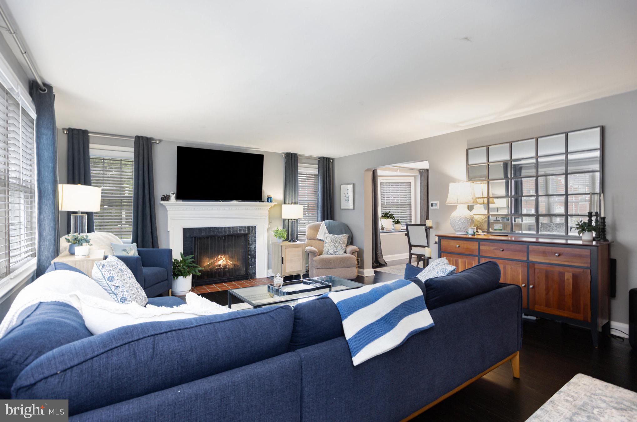 1500 Doxbury Road Baltimore, MD 21286 - Photo 6 of 36 a living room with furniture a fireplace and a flat screen tv