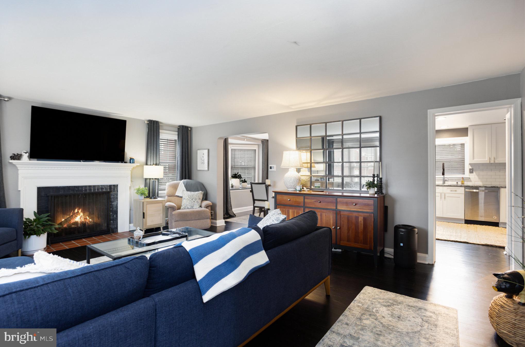 1500 Doxbury Road Baltimore, MD 21286 - Photo 7 of 36 a living room with furniture a fireplace and a flat screen tv