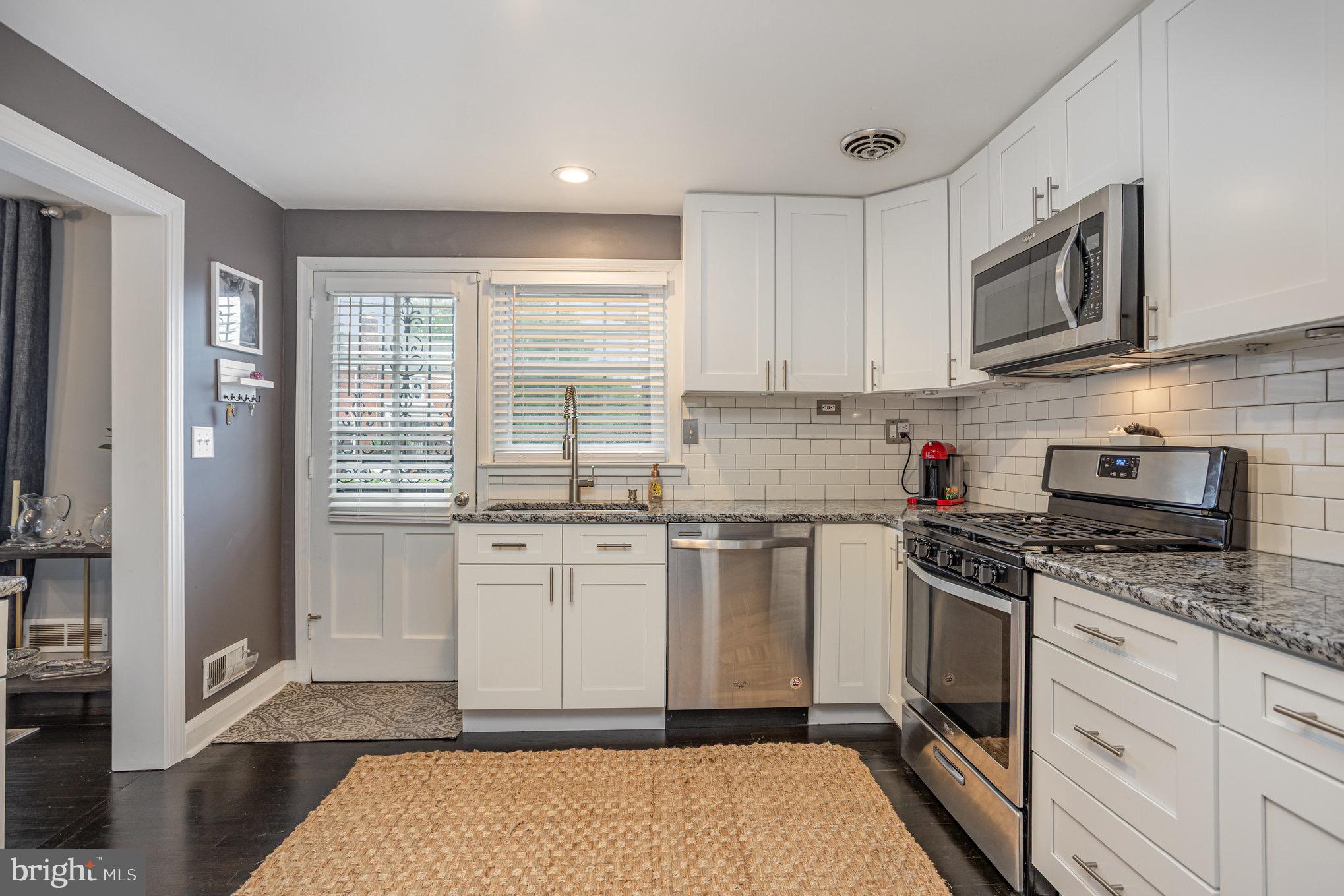 1500 Doxbury Road Baltimore, MD 21286 - Photo 10 of 36 a kitchen with stainless steel appliances granite countertop a stove a sink and a refrigerator