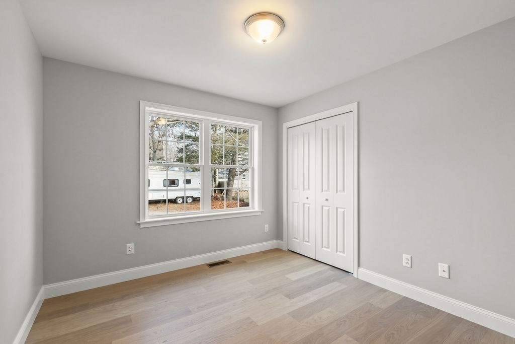 81 Maple Springs Road Wareham, MA 02571 - Photo 13 of 17 an empty room with windows and closet