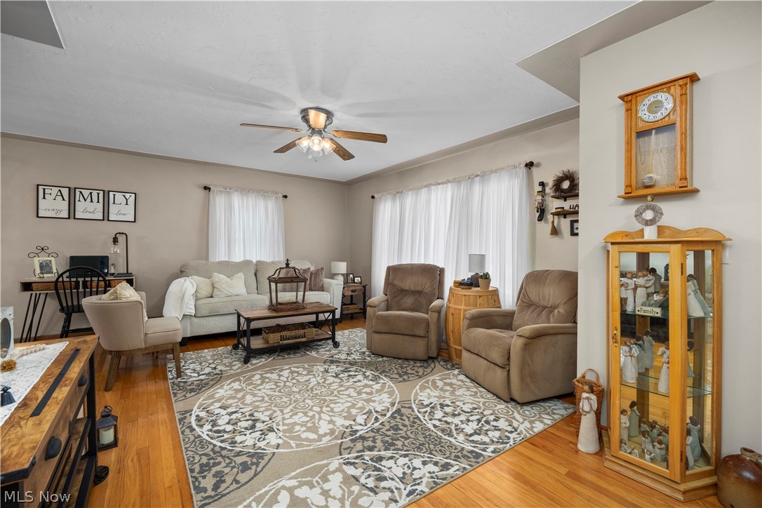965 Gulf Road Elyria, OH 44035 - Photo 4 of 37 Living room featuring light hardwood floors and ceiling fan and windows