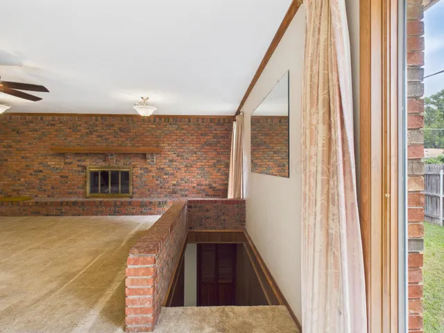 a view of a balcony with wooden floor and staircase