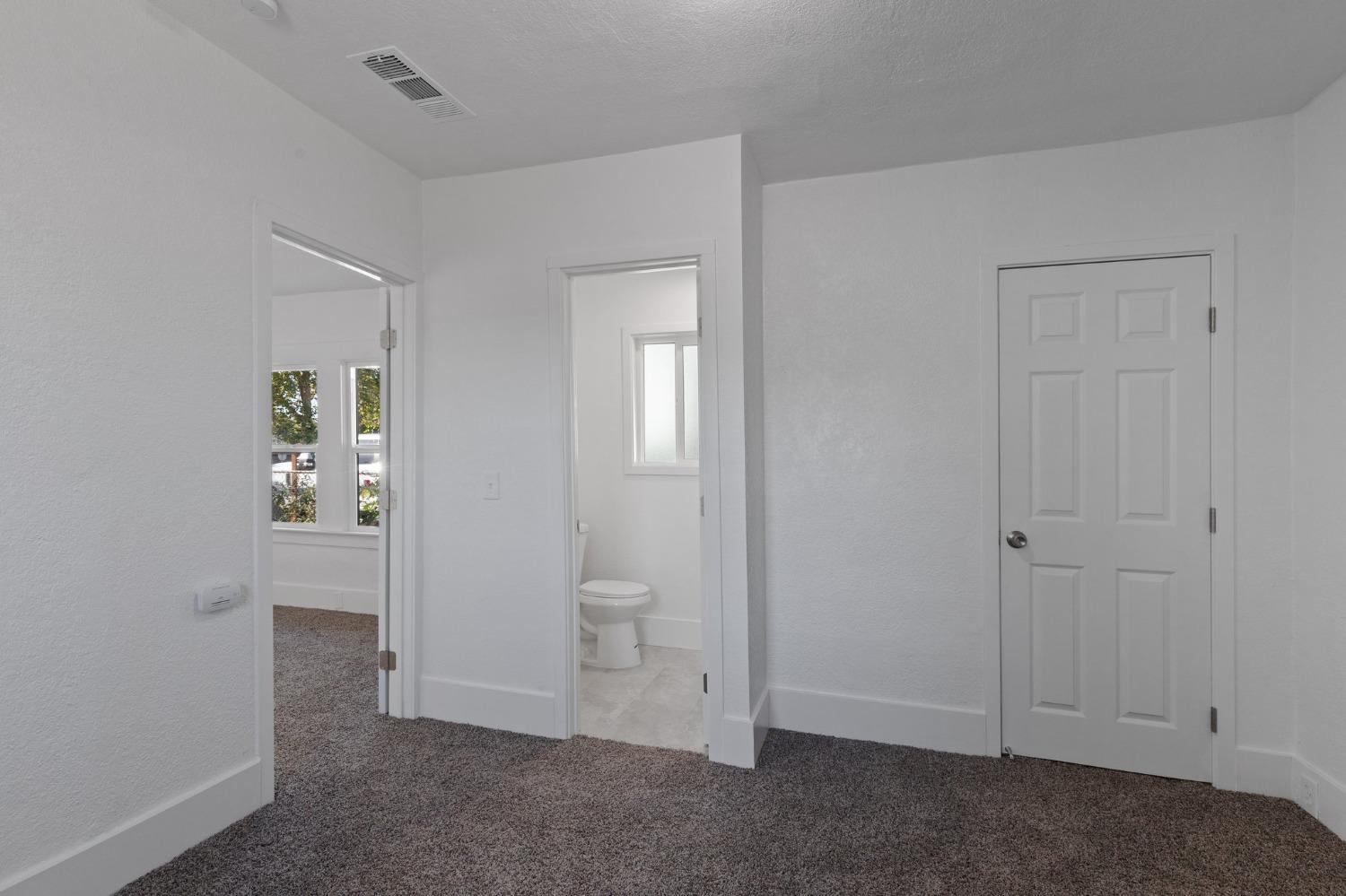 3321 East Montecito Avenue Fresno, CA 93702 - Photo 16 of 22 wooden view of an empty room