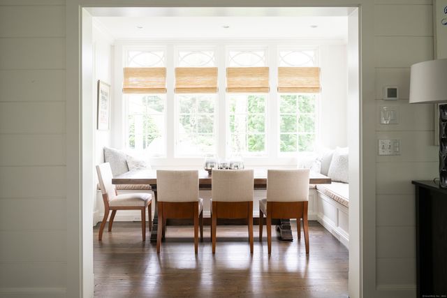 a view of a dining room with furniture and wooden floor