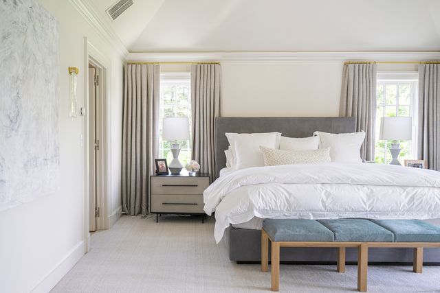 a bedroom with a bed and a table