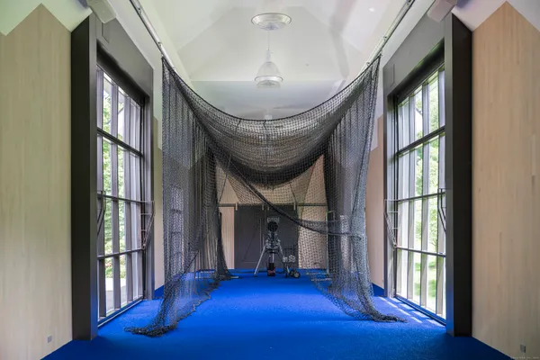 wooden floor in an empty room with wooden floor and windows
