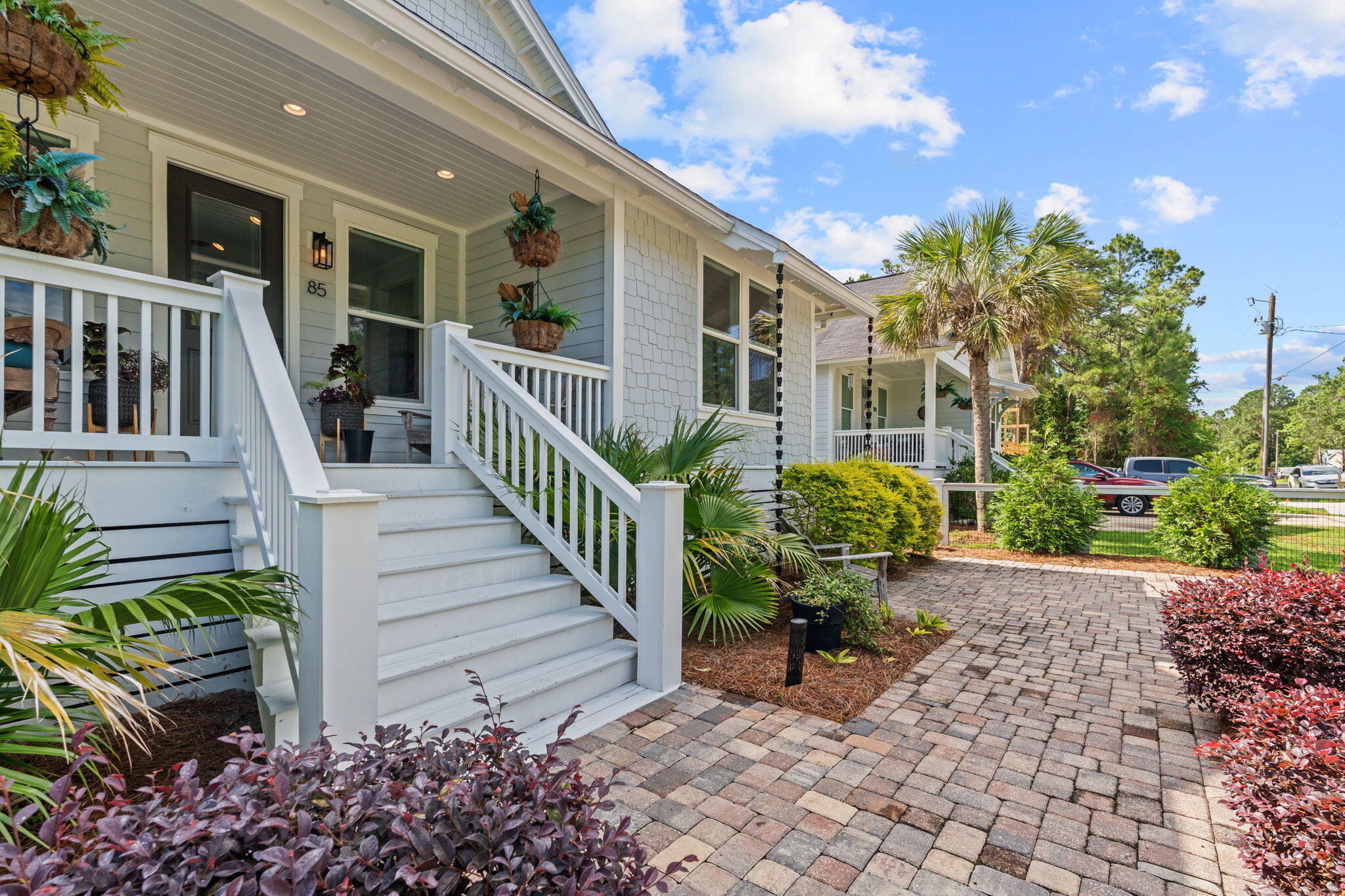 85 6th Street Santa Rosa Beach, FL 32459 - Photo 3 of 35 a view of a house with chairs and flower plants