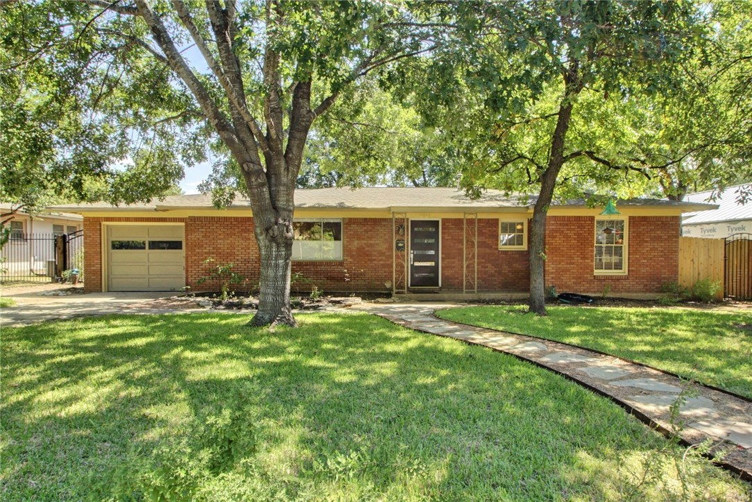 front view of a house with a yard