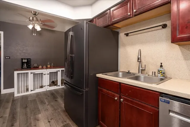 a kitchen with a sink and cabinets