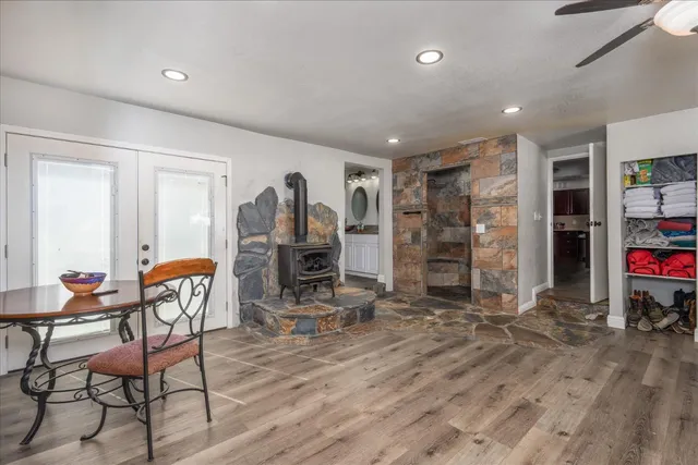 a dining room with furniture and a window
