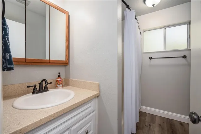 a bathroom with a sink and a mirror