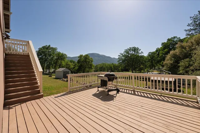 a view of balcony with deck and wooden floor