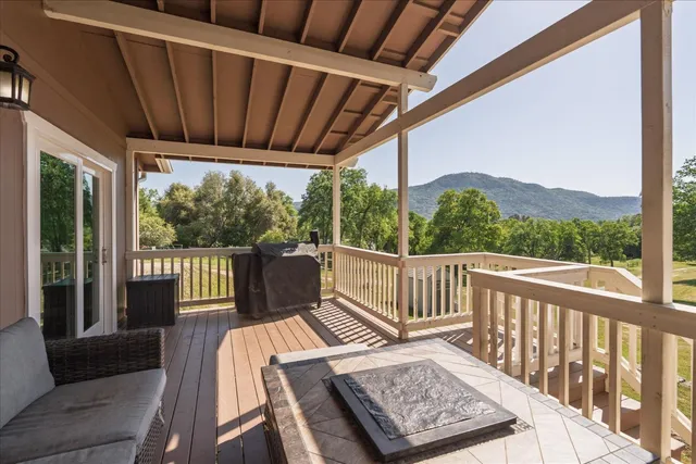 a view of a two chairs in the deck