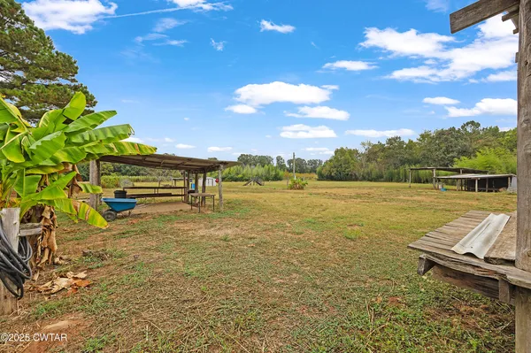 a view of a lake with a lawn chairs