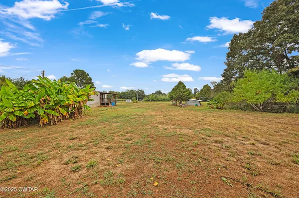 a view of a lake with a yard
