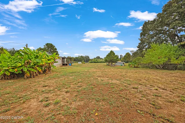 a view of a lake with a yard