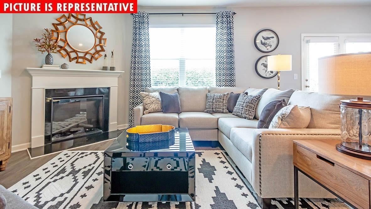 1204 Secrest Cmns Drive Monroe, NC 28112 - Photo 10 of 22 a living room with furniture and a fireplace