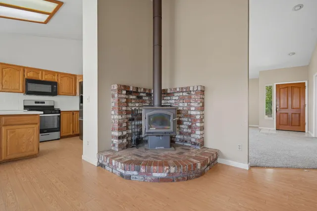 a view of a dining room with furniture and a rug