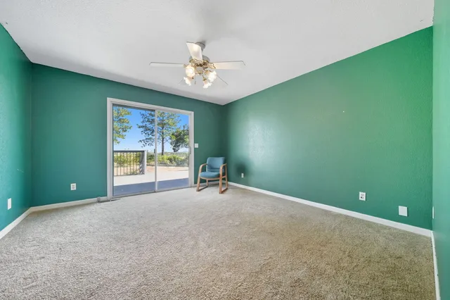 a spacious bathroom with a large tub and sink