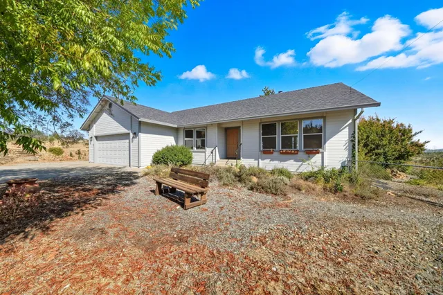 a living room with furniture a rug and a chandelier