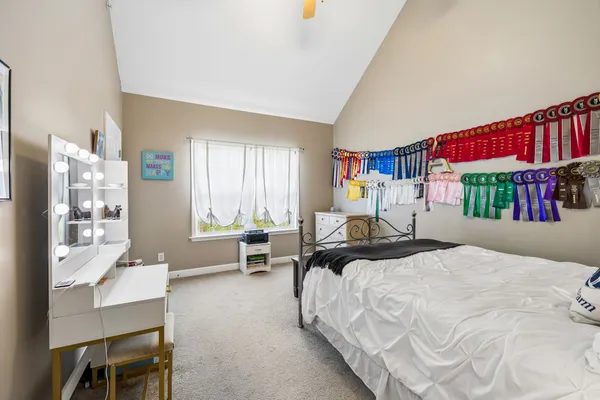 a bedroom with a bed and window