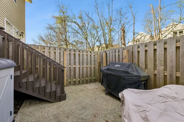 an aerial view of residential house with outdoor space and seating