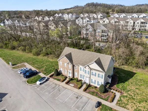 an aerial view of a house with a ocean view