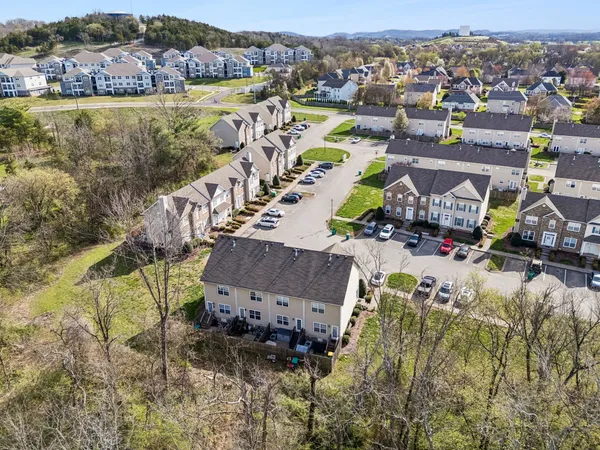 aerial view of a house with a yard