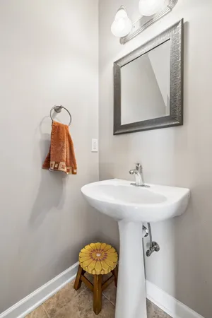 a bathroom with a sink a mirror and toilet