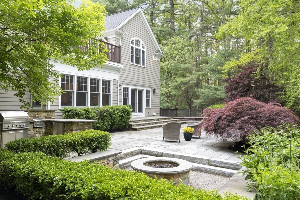 244 Musterfield Road Concord, MA 01742 - Photo 39 of 42 a view of a house with a yard and sitting area