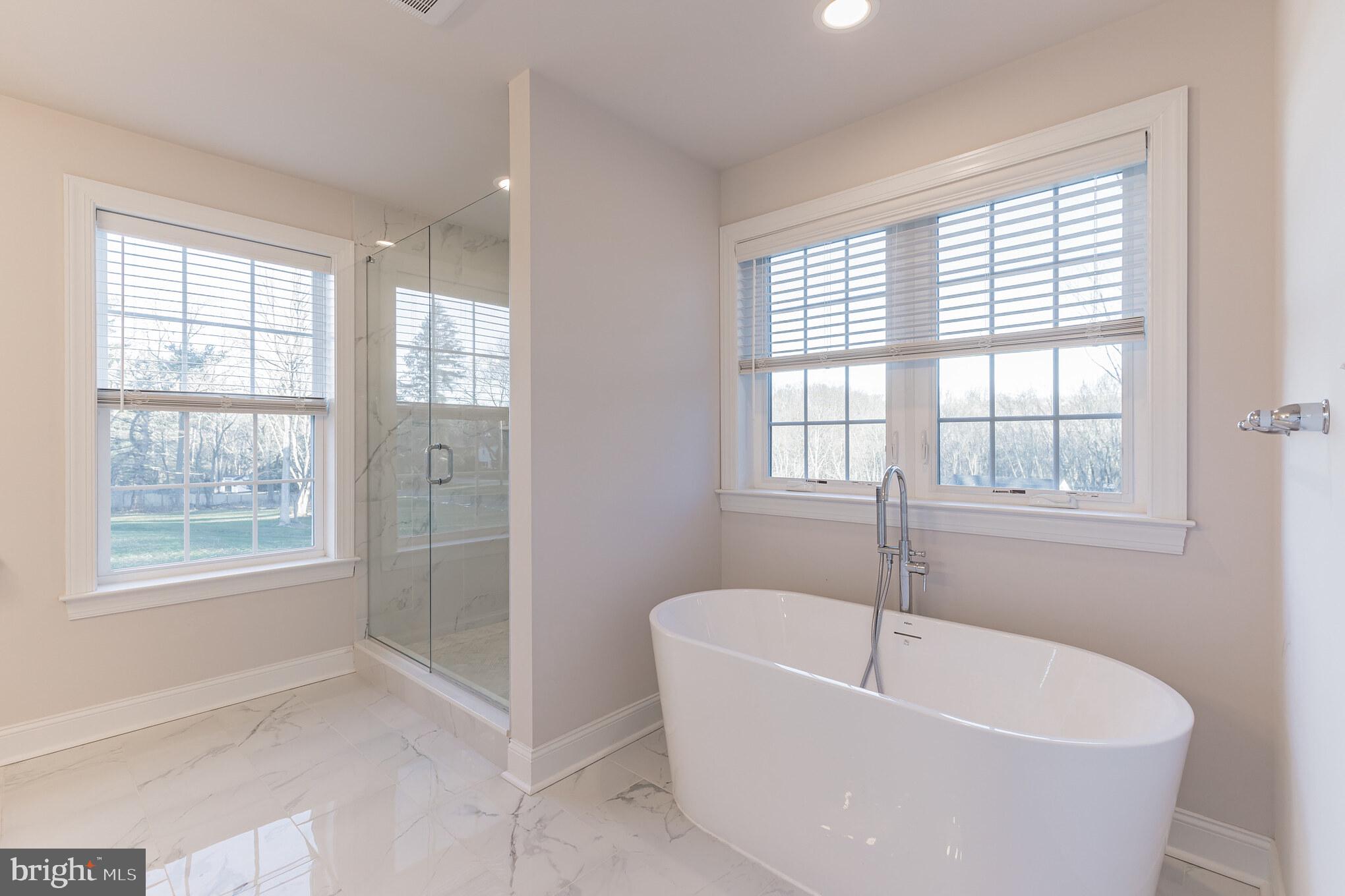 235 Howarth Road Media, PA 19063 - Photo 27 of 46 Chic soaking tub, marble tiles & glass shower