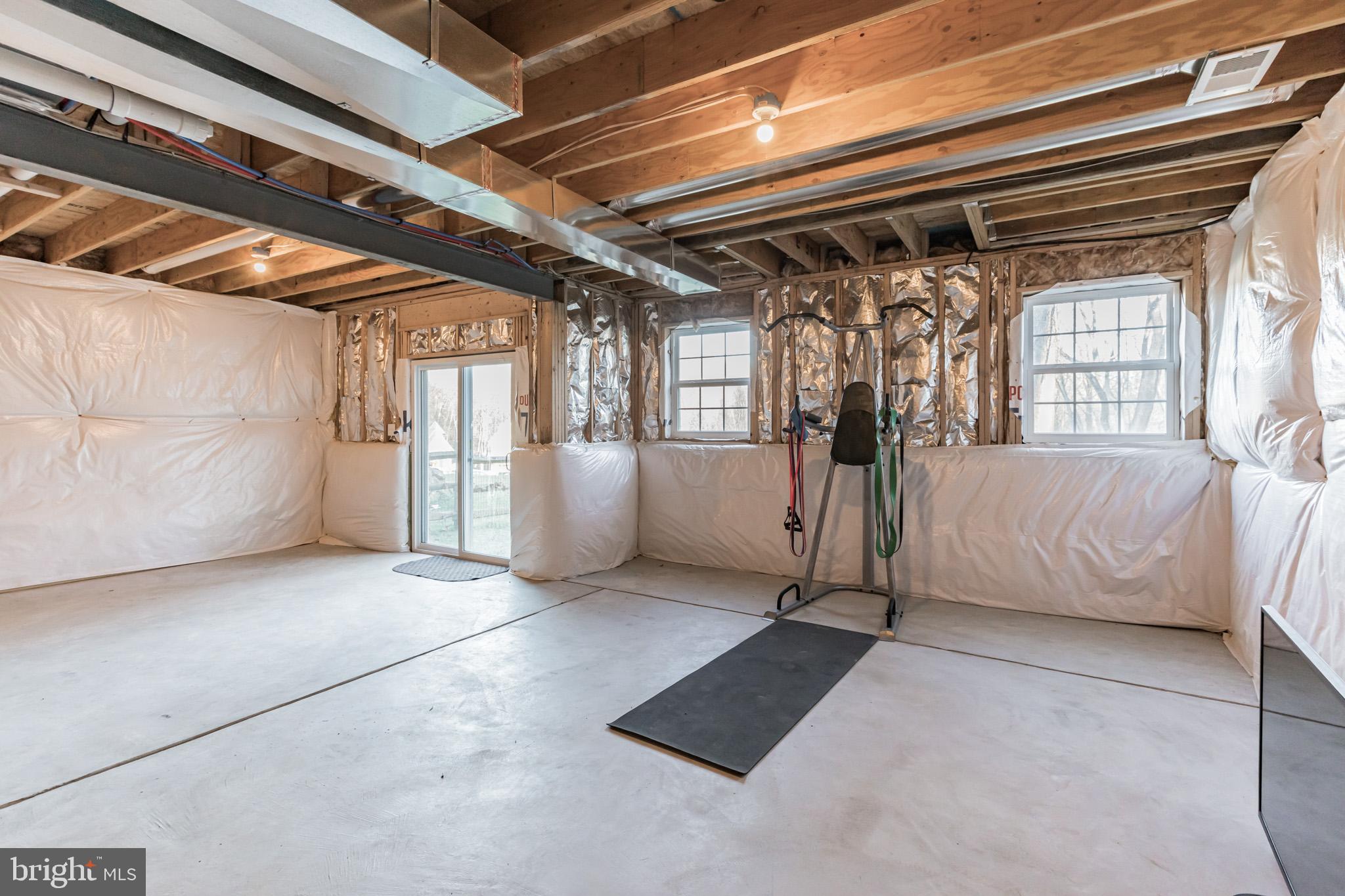 235 Howarth Road Media, PA 19063 - Photo 33 of 46 Basement w/ high ceilings, windows & sliders