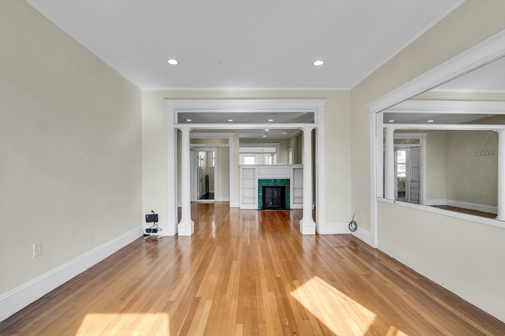 41 Orkney Road Boston, MA 02135 - Photo 11 of 28 a view of a room with wooden floor and staircase