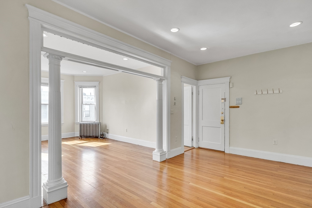 41 Orkney Road Boston, MA 02135 - Photo 8 of 28 a view of livingroom with wooden floor