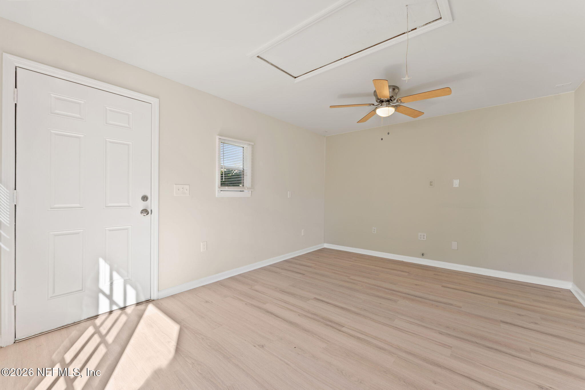 4517 Delta Avenue Jacksonville, FL 32205 - Photo 17 of 25 a view of a big room with wooden floor and a chandelier fan