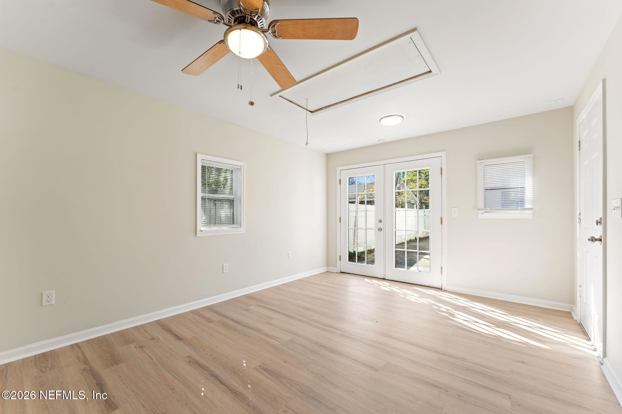 4517 Delta Avenue Jacksonville, FL 32205 - Photo 18 of 25 wooden floor in an empty room with a window