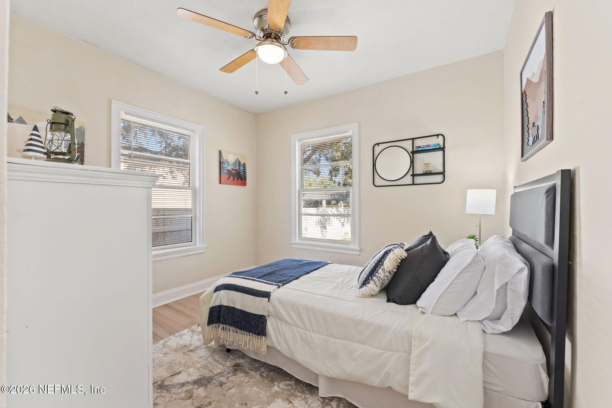 4517 Delta Avenue Jacksonville, FL 32205 - Photo 19 of 25 a bedroom with a bed and a chandelier