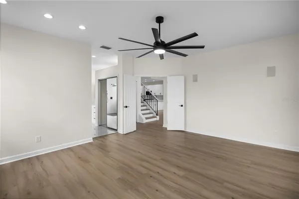 a bathroom with a double vanity sink mirror and bathtub