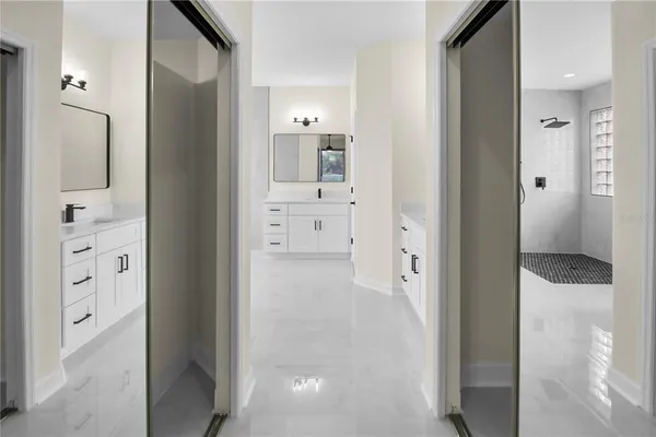 a bathroom with a double vanity sink and mirror