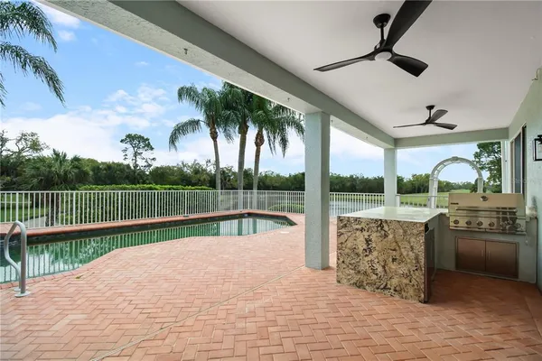 a view of swimming pool with a patio and swimming pool