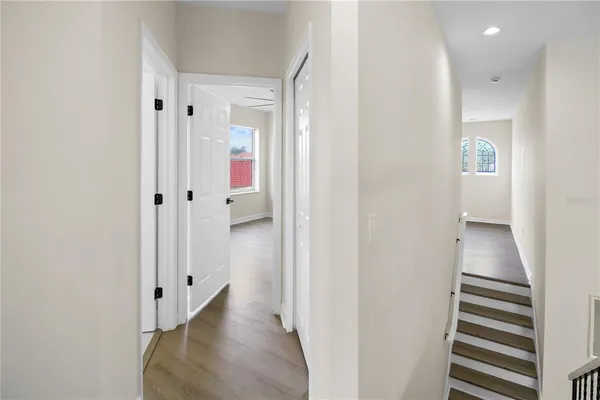 a bathroom with a sink a mirror a toilet and bathtub