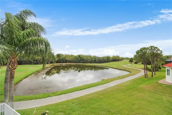a view of a lake with a yard