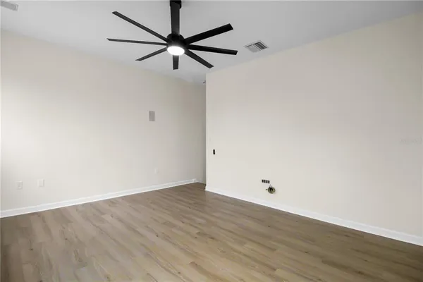 a view of a living room and a balcony