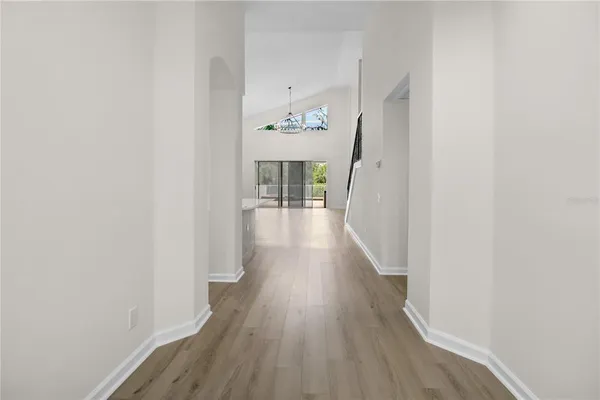 a view of a hallway view with wooden floor