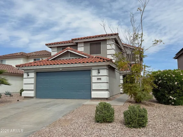a front view of a house with a garage
