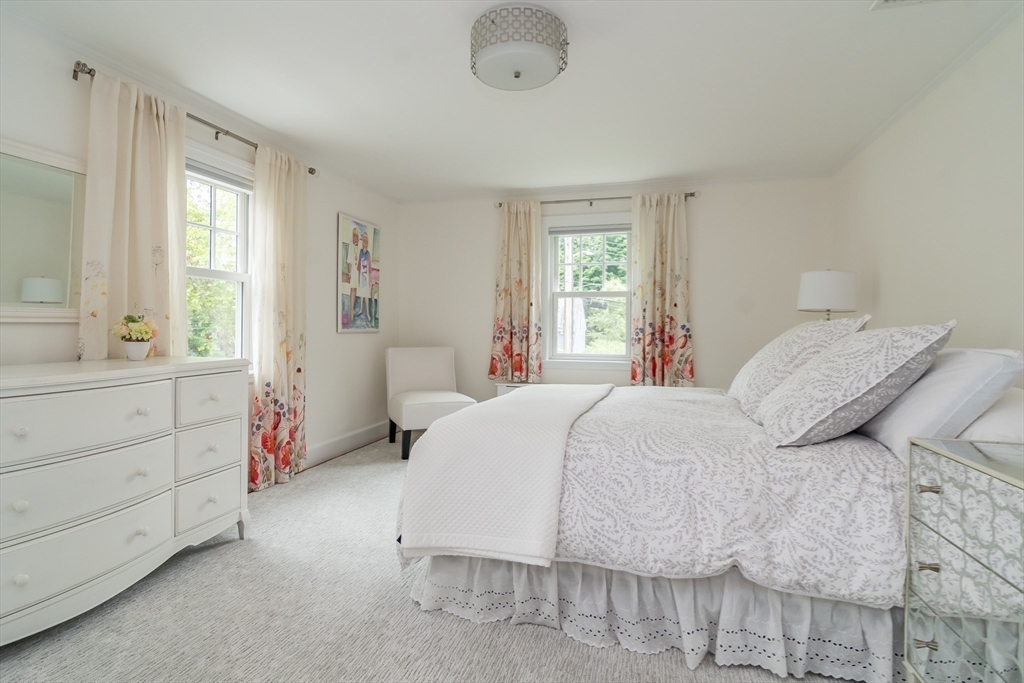 27 Appleby Road Wellesley, MA 02482 - Photo 13 of 23 a bedroom with a bed a window and dresser