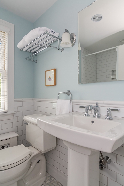 27 Appleby Road Wellesley, MA 02482 - Photo 16 of 23 a bathroom with a sink a toilet and mirror