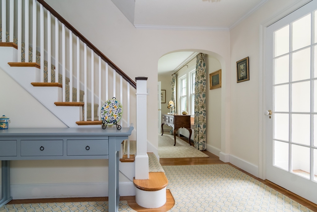 27 Appleby Road Wellesley, MA 02482 - Photo 2 of 23 a living room with wooden floor and a potted plant