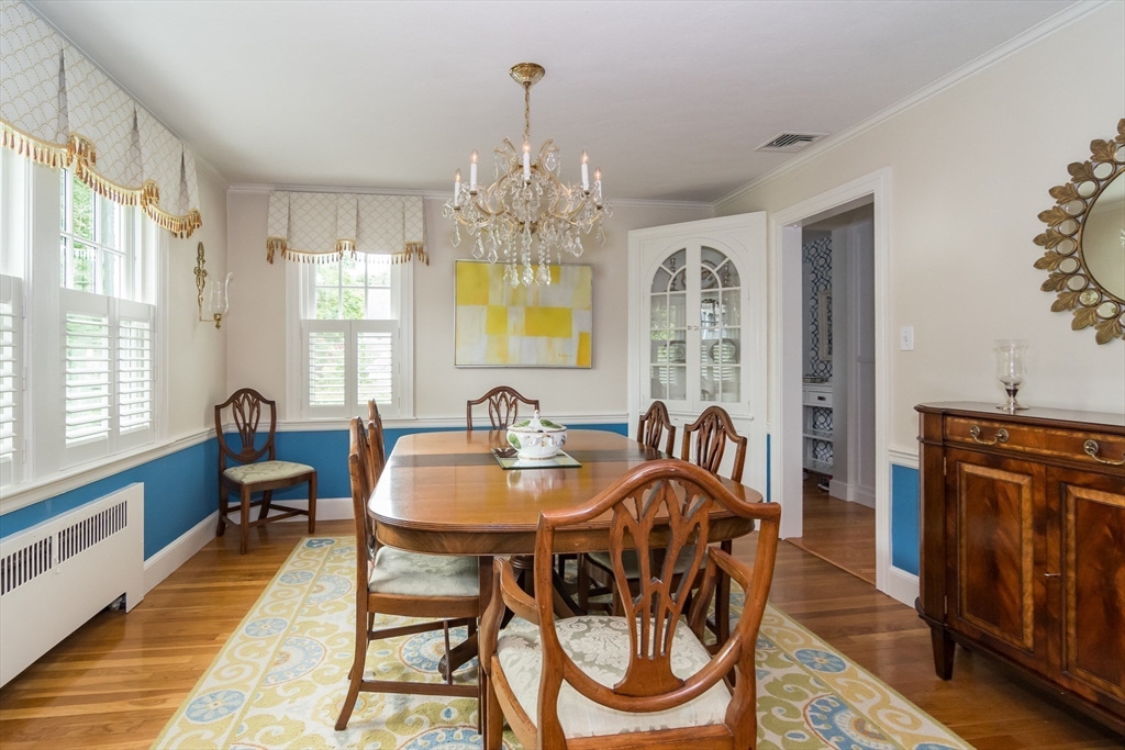 27 Appleby Road Wellesley, MA 02482 - Photo 4 of 23 a dining room with furniture a chandelier and wooden floor